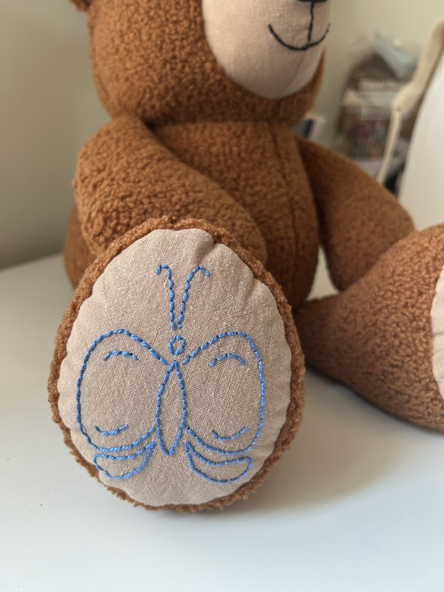 Copper bereavement bear with cobalt embroidery