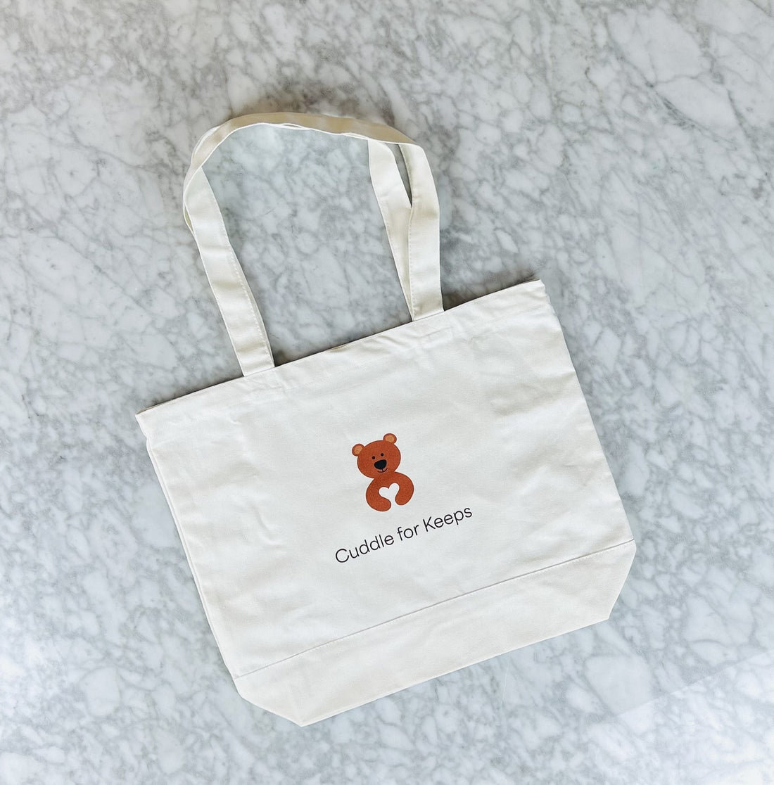 Cuddle for Keeps tote bag.